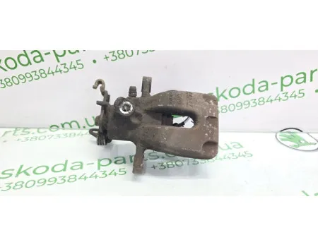 Супорт гальмівний задній лівий Skoda Octavia A7 універсал 1.6 TDI VAG (5Q0615423A)
